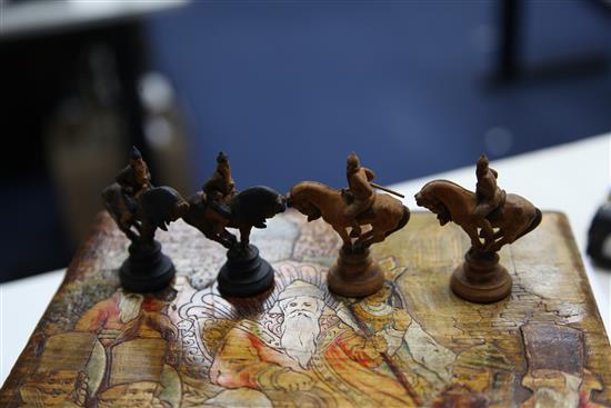 An unusual 19th century Russian figural carved wood chess set,